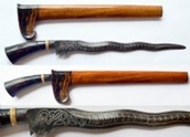 A 19th century Indonesian Malay Kris with silver inlaid wavy double-edged Damascus steel blade