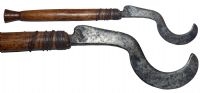 A rare late 19th century Tutsi Sickle Knife with a hard wood hilt