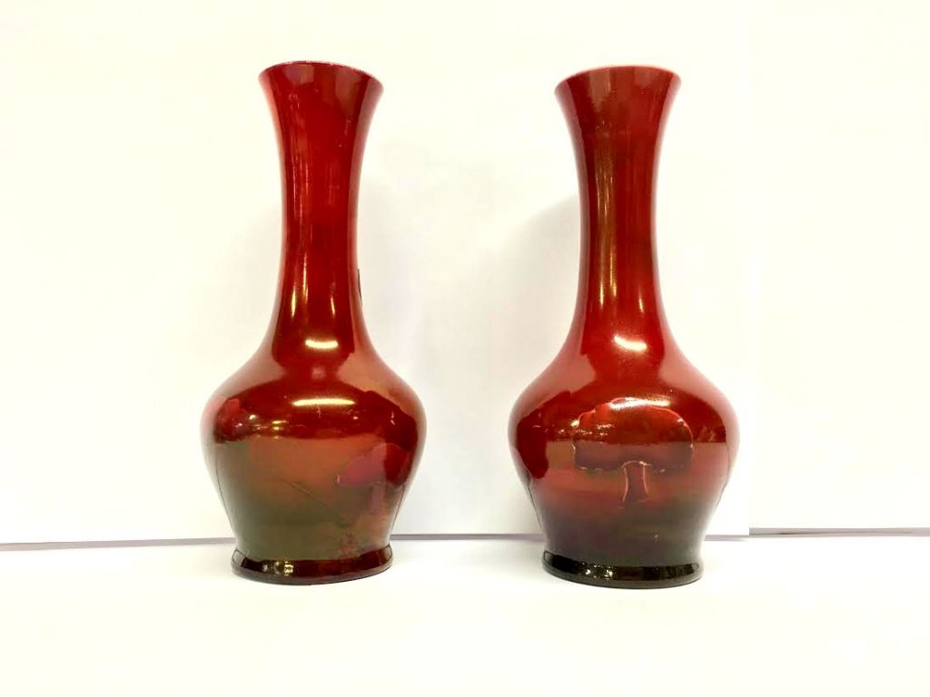 A pair of Ruby Lustre Hazeldene Flambe vases by William Moorcroft made for Liberty circa 1907