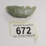 An apple green jadeite jade fish motif pendant