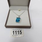 A sky blue topaz pendant set in silver approximately 12 carats