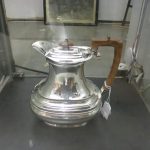 A silver hot water jug, hall marked for Sheffield