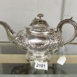 An ornate 19th century silver teapot