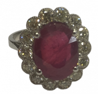 A 6.5 carat oval ruby platinum and diamond ring, size N half, 8 grams.