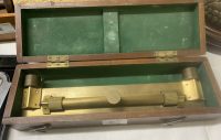 Draughtsman’s brass ruler with 2 dimensional serrated brass wheels allowing angled position. In fitted wood box.