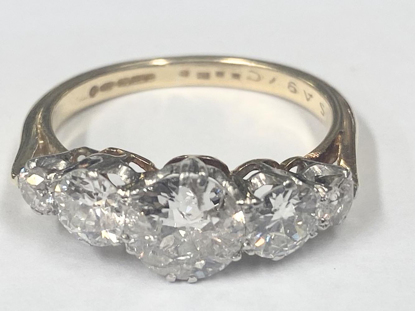 An 18ct 5 stone ring set early round brilliantold cut diamonds