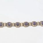 An 18ct gold 585 bracelet set six large amethyst stones