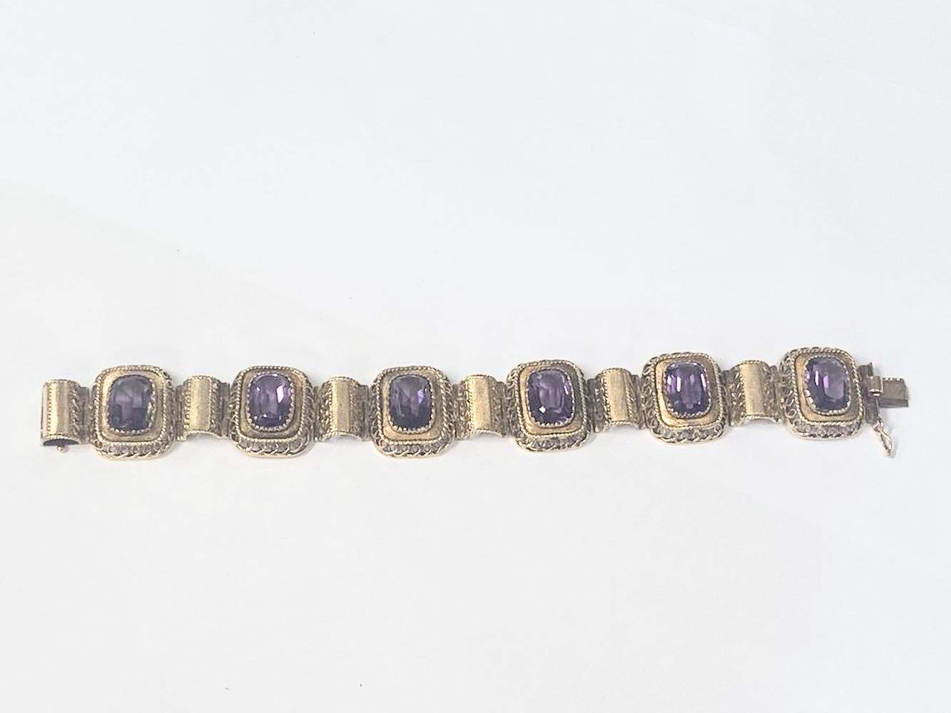 An 18ct gold 585 bracelet set six large amethyst stones